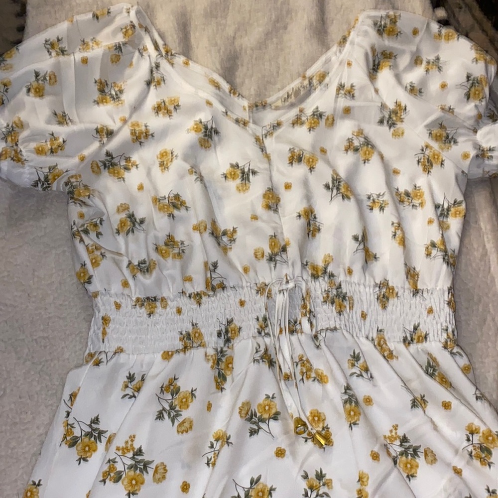 Yellow flower print white dress with faux tie waist , stretchy waist . ruffly
